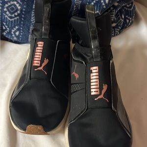 Black and rose gold pumas